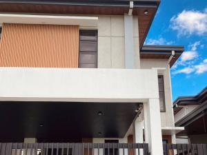 a house with a fence in front of it at 4 Bedroom Villa near Clark (Casa Isabela) in Mabalacat