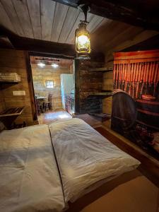 a bedroom with a large bed in a cabin at Glamping Paradise Škatlar in Otočec