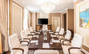 a conference room with a long table and chairs at Wellness Park Hotel Bactria in Samarkand