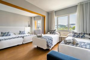 Postel nebo postele na pokoji v ubytování Hotel Beleret