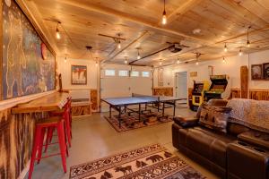 a living room with a ping pong table at Escape Route Retreat in Lincoln