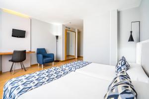 Postel nebo postele na pokoji v ubytování Hotel Beleret