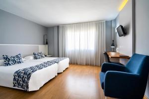 Postel nebo postele na pokoji v ubytování Hotel Beleret + 37 fotografií