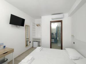 Postel nebo postele na pokoji v ubytování Zenia Rooms