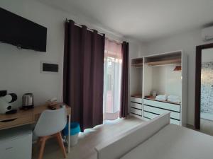 Postel nebo postele na pokoji v ubytování Zenia Rooms