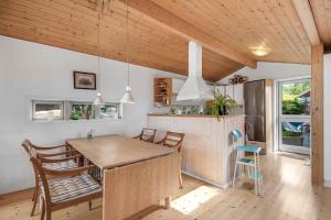 A kitchen or kitchenette at Holiday Home On The Beach With Panoramic View Sunset View