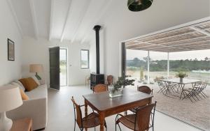 a living room with a table and a couch at Amaria in Aljezur