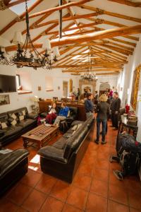 a group of people standing in a living room at Hotel Rumi Punku in Cusco
