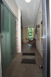 a hallway of a house with a glass door at Au Vieux Chêne in Malmedy