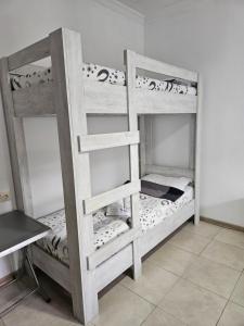 A bed or beds in a room at Guest house Junona