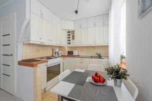 Kuchyňa alebo kuchynka v ubytovaní Apartament z balkonem przy Latarni 150m od morza