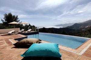 a swimming pool with a view of the mountains at Villa Valdiego in La Herradura