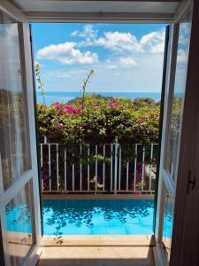 a view from a window of a swimming pool at Hotel Villa Degli Aranci in Maratea