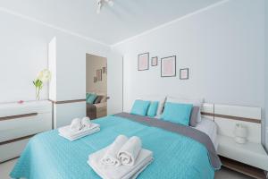 Posteľ alebo postele v izbe v ubytovaní Apartament z balkonem przy Latarni 150m od morza
