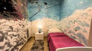 a bedroom with a bed and a painting on the wall at Sina Rent Room in Rome