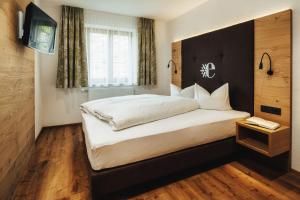 Posteľ alebo postele v izbe v ubytovaní Hotel Edelweiss Superior