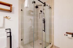 a shower with a glass door in a bathroom at Walling Mountain Retreat in Groveland +49 photos
