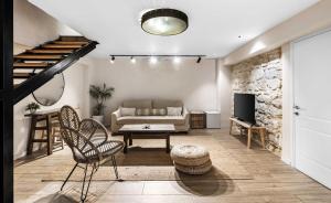 a living room with a couch and a table at Hotel Anilevich Mansion in Beer Sheva