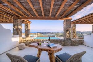 a villa with a view of the pool at Legendary Suites in Mýkonos City