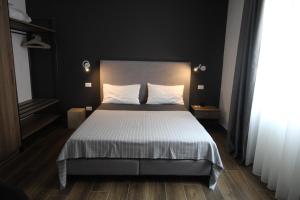 Postel nebo postele na pokoji v ubytování INSULA FELIX Bed&Breakfast