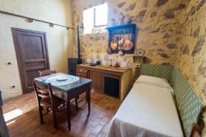 Postel nebo postele na pokoji v ubytování Feudo Rosso di Cerami