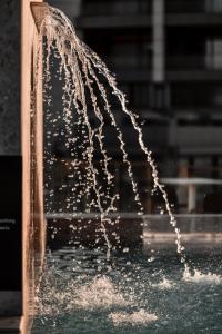 a close up of a water fountain at Grands Suites Hotel Residences and Spa in Il-Gżira