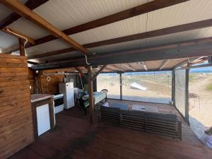 a view of a kitchen and a living room in a house at SEA CARAVAN ON THE BEACH in Kiten