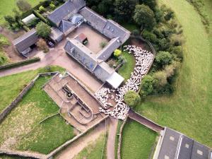 an aerial view of a house with a yard at Eastside Byre - Family cottage in the Pentland Hills near Edinburgh in Penicuik