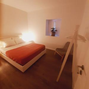 a bedroom with a bed and a camera at Casa de Bairros in Soajo