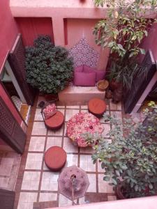 a view of a patio with a bunch of plants at Logement entier riad Dar Sana in Marrakesh