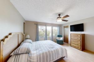 En eller flere senge i et værelse på Citrus Cottage