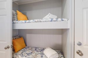 a closet with two bunk beds in it at Sea Side Villas 108 in Hilton Head Island +18 photos