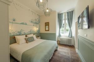 Manoir de Laroque Delprat客房内的一张或多张床位