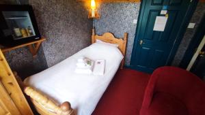 Postel nebo postele na pokoji v ubytování Herrislea House Hotel