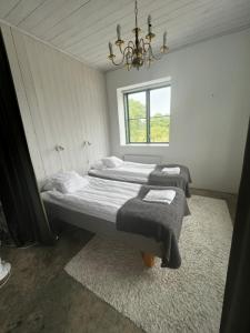 En eller flere senge i et værelse på Visby City Apartments S:t Hansgatan