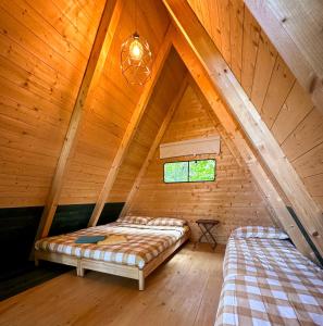 A bed or beds in a room at Camping Federico Farm