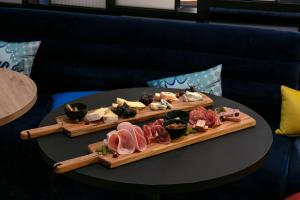a plate of food on a table with sushi at Aloft Strasbourg City Centre in Strasbourg