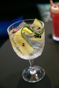 a wine glass with a slice of apple in it at Aloft Strasbourg Etoile in Strasbourg