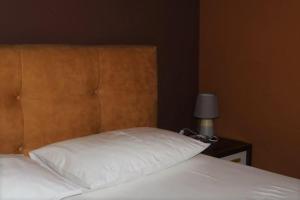 Postel nebo postele na pokoji v ubytování Hotel Ceka