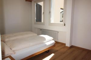 Postel nebo postele na pokoji v ubytování Residenza Lagrev 2 Zimmerwohnung Nr 112 - Typ 21B - 1 Etage - Süd