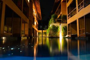an empty courtyard of an apartment building at night at Avatar Railay in Railay Beach