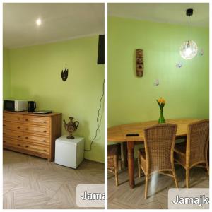 uma sala de jantar com uma mesa de madeira e uma parede verde em Lusesita 