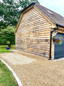 a garage with a flower pot on the side of it at The Nest in Rake