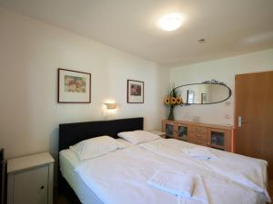 Ένα ή περισσότερα κρεβάτια σε δωμάτιο στο Apartment Am Sternberg 230 by Interhome