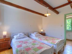 Postel nebo postele na pokoji v ubytování Holiday Home Pinia II by Interhome