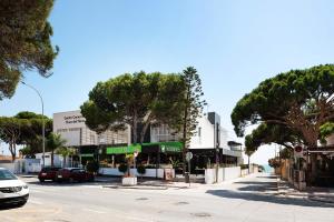 a street with cars parked on the side of a road at Mariola in Novo Sancti Petri