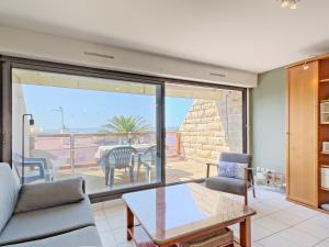 a living room with a view of the ocean at Apartment Belle Vue Mer et Groix by Interhome in Ploemeur +23 photos