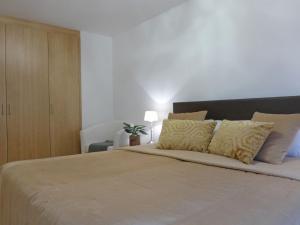 Postel nebo postele na pokoji v ubytování Apartment Panoramapark Soleil Haus D Apt 3 by Interhome