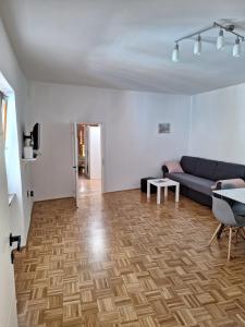 a living room with a couch and a table at Apartment Kp with parking in Koper