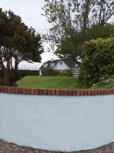 a retaining wall in front of a house at Ard Falcon in Cork